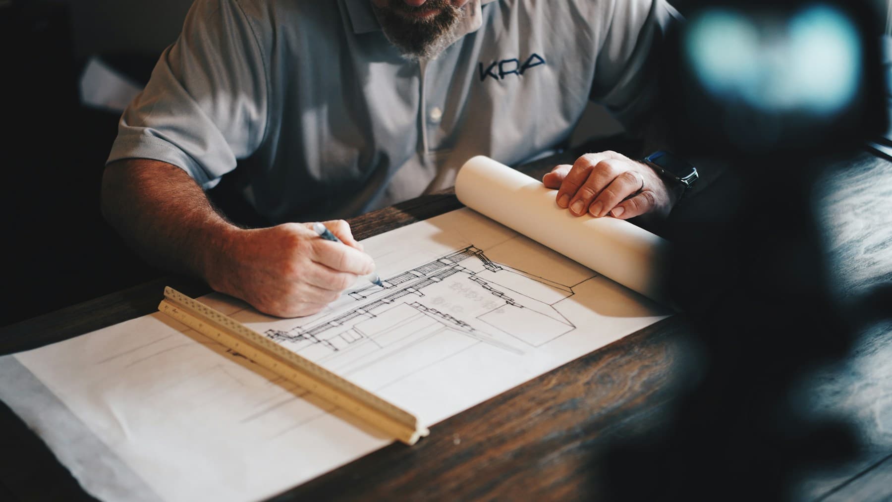 Engineer working on CAD drawings and technical documentation